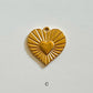Sunburst heart charm