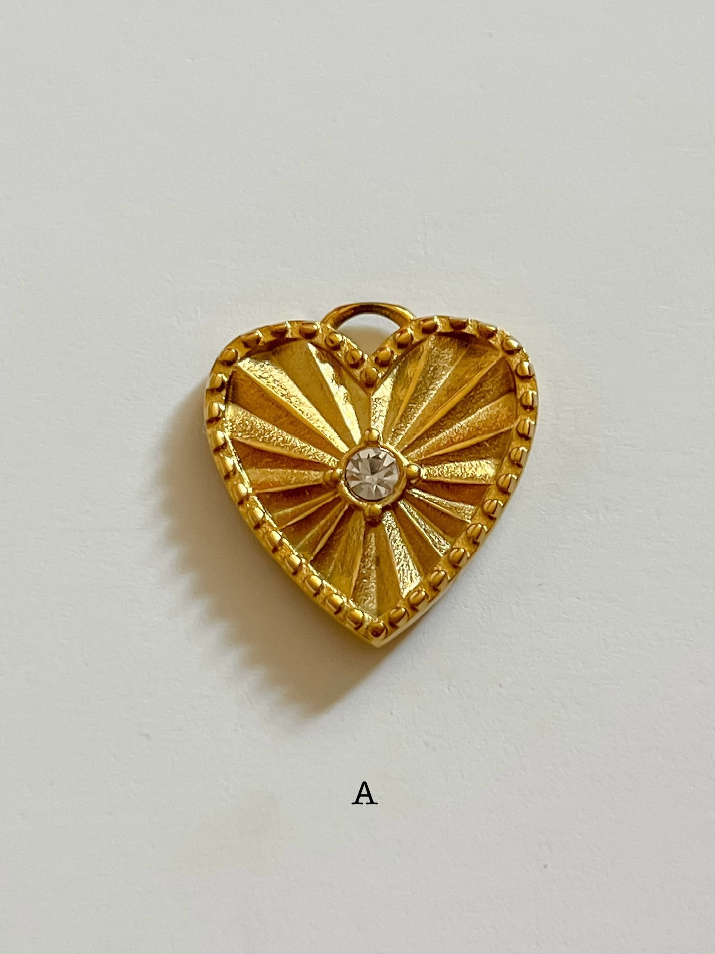 Sunburst heart charm