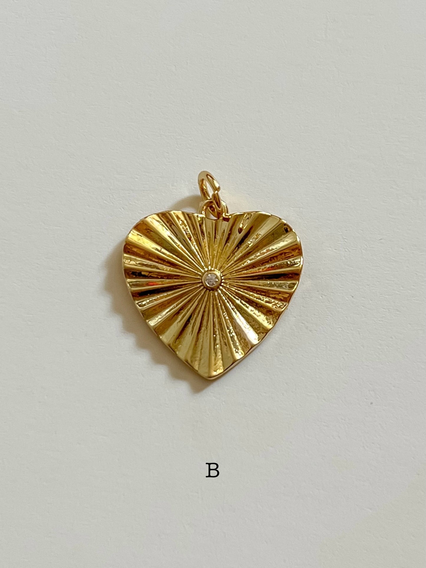 Sunburst heart charm