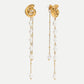Pearly snail dangle earrings